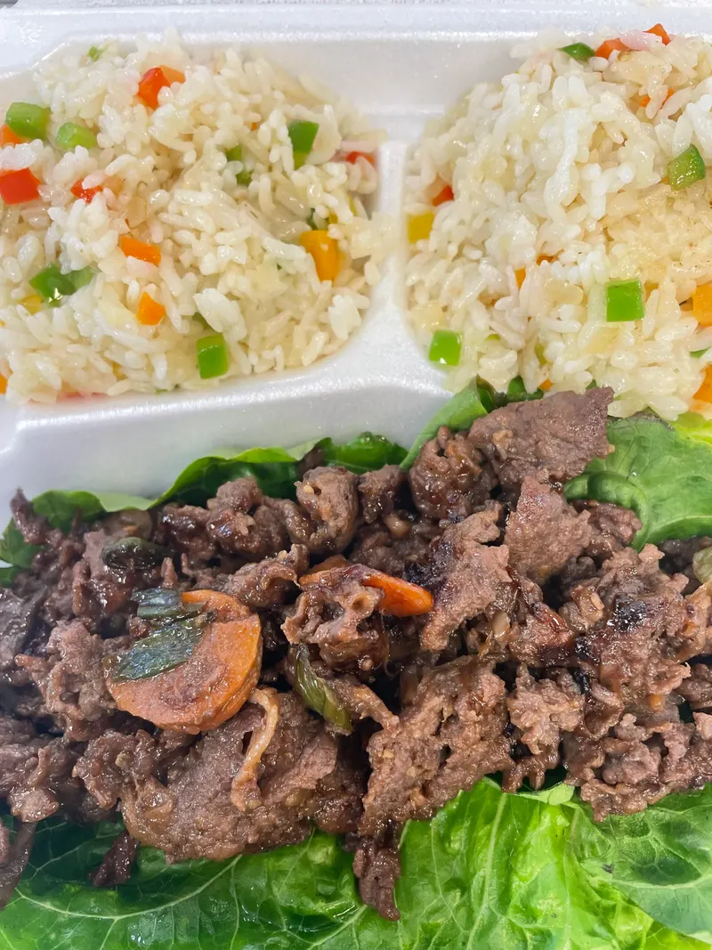 Bulgogi over lettuce with fried rice